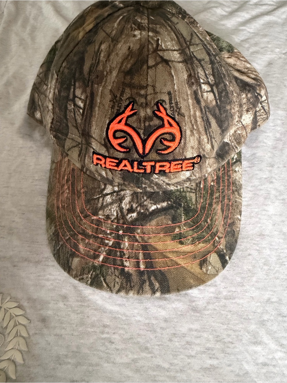 Realtree Camo Hat with Bright Orange Logo